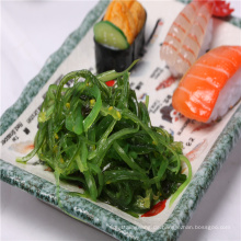 Chukka Hiyashi Sesam / Wasabi / Kaltkohl mit rotem Chili gewürzt Seetang Salat